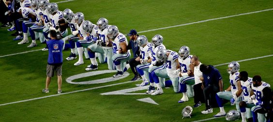 Cowboys kneeling